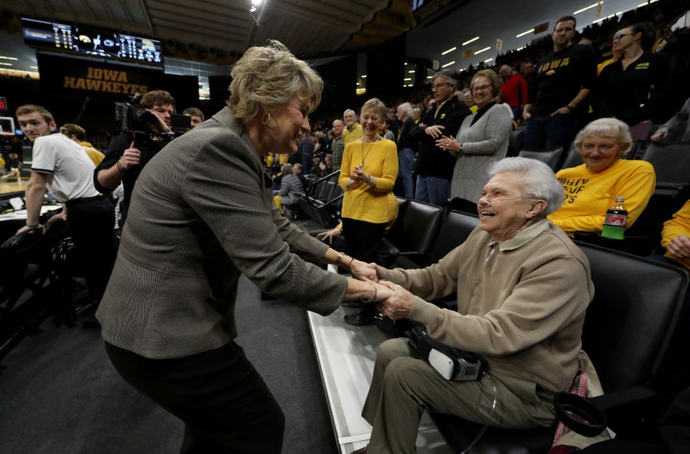 Iowa Hawkeyes head coach Lisa Bluder shakes hands with women's athletic director Dr. Christine Grant before their game against Penn State Saturday, February 22, 2020 at Carver-Hawkeye Arena. (Brian Ray/hawkeyesports.com)