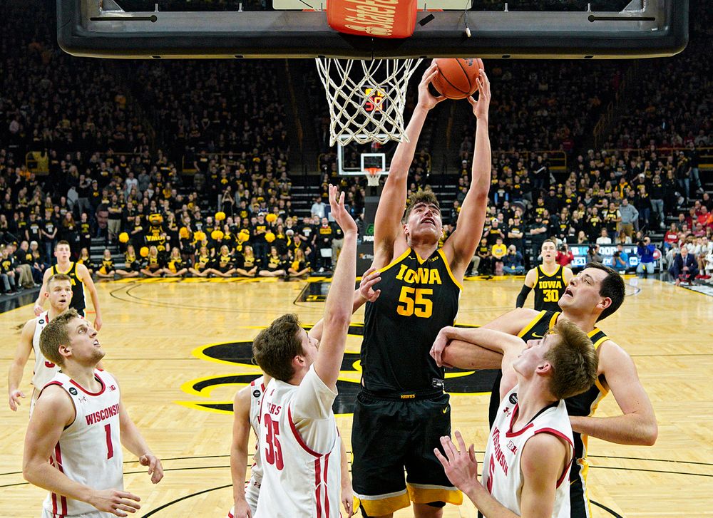 Iowa Hawkeyes center Luka Garza (55) pulls in a rebound during the second half of their game at Carver-Hawkeye Arena in Iowa City on Monday, January 27, 2020. (Stephen Mally/hawkeyesports.com)