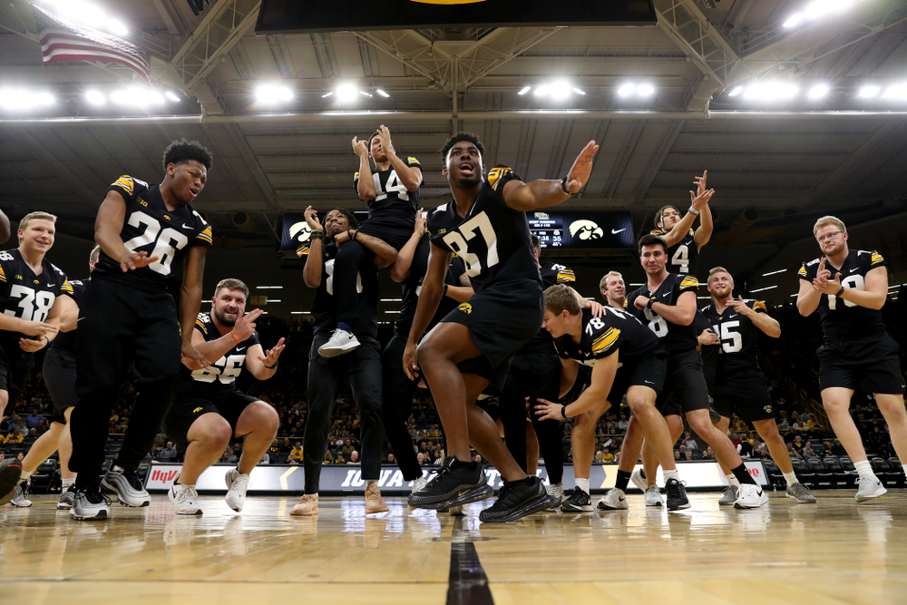 Members of the Hawkeye Football team performs with the Iowa Dance Team at halftime of the Iowa Hawkeyes game against the Ohio State Buckeyes Thursday, February 20, 2020 at Carver-Hawkeye Arena. (Brian Ray/hawkeyesports.com)