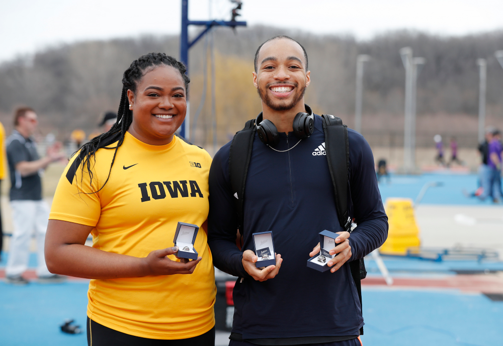 Iowa's Laulauga Tausaga and Aaron Mallett receive their Big Ten Championship rings during the 2018 MUSCO Twilight Invitational Thursday, April 12, 2018 at the Cretzmeyer Track. (Brian Ray/hawkeyesports.com)