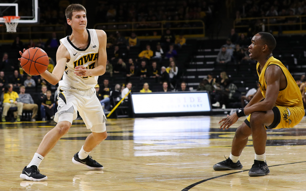 Iowa Hawkeyes guard Austin Ash (13) passes the ball during a game against Alabama State at Carver-Hawkeye Arena on November 21, 2018. (Tork Mason/hawkeyesports.com)