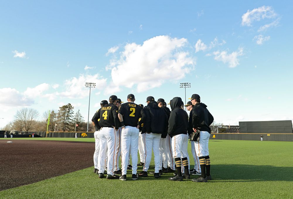 The Hawkeyes huddle before their game at Duane Banks Field in Iowa City on Tuesday, March 3, 2020. (Stephen Mally/hawkeyesports.com)
