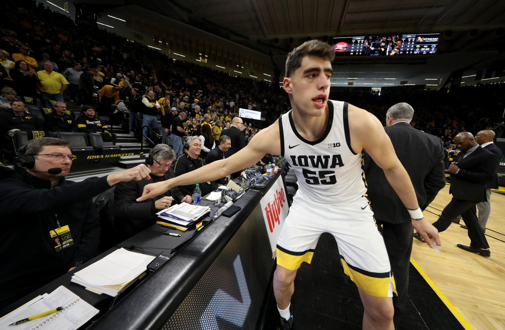Iowa Hawkeyes forward Luka Garza (55) fist bumps the radio crew before their game against Penn State Saturday, February 29, 2020 at Carver-Hawkeye Arena. (Brian Ray/hawkeyesports.com)