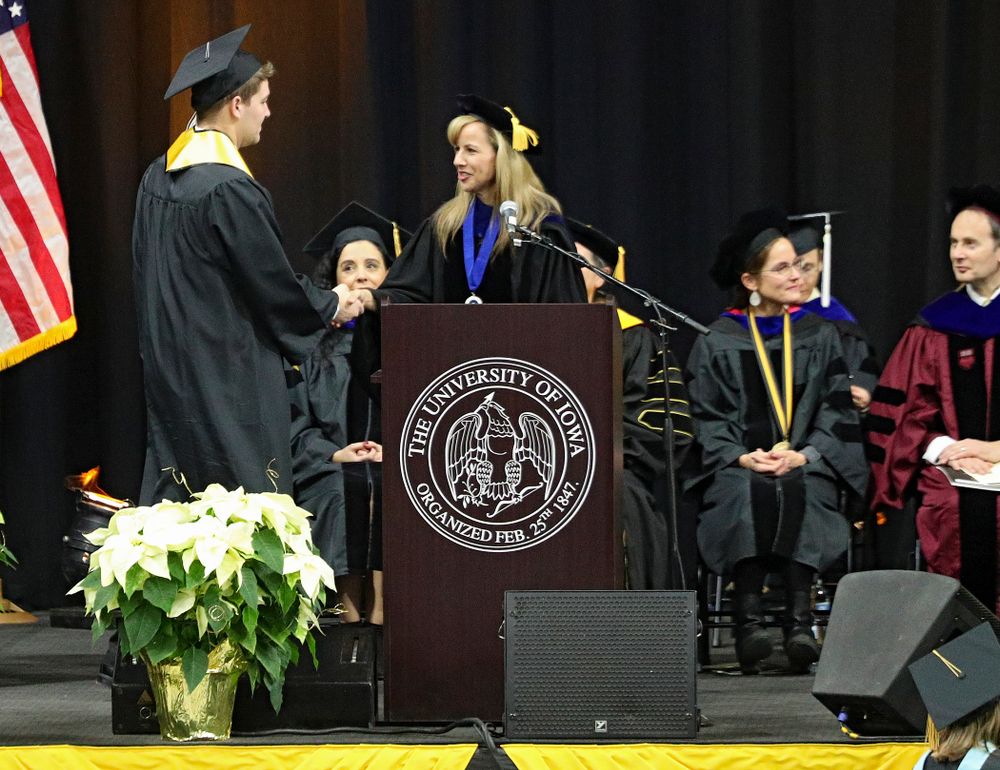 Iowa Spirit Squad’s Joseph Bartemes during the College of Liberal Arts and Sciences and University College Fall 2019 Commencement ceremony at Carver-Hawkeye Arena in Iowa City on Saturday, December 21, 2019. (Stephen Mally/hawkeyesports.com)