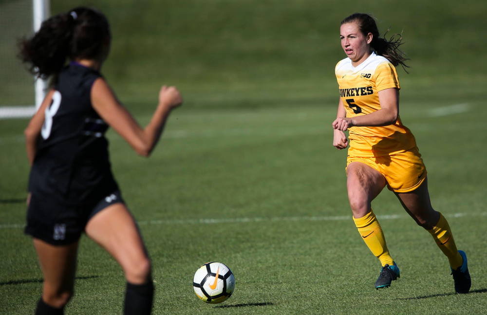 Iowa Hawkeyes defender Riley Whitaker (5) dribbles the ball during a game against Northwestern at the Iowa Soccer Complex on October 21, 2018. (Tork Mason/hawkeyesports.com)