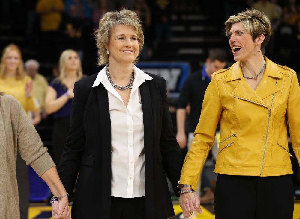 Iowa Hawkeyes head coach Lisa Bluder watches as her daughter Emma sings the National Anthem before the Iowa Hawkeyes game against the Northwestern Wildcats Sunday, March 3, 2019 at Carver-Hawkeye Arena. (Brian Ray/hawkeyesports.com)