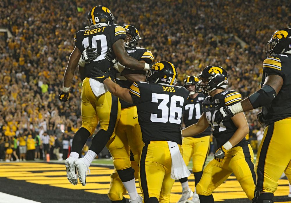 Iowa Hawkeyes running back Mekhi Sargent (10) celebrates after scoring a touchdown on a 2-yard run during the third quarter of their game at Kinnick Stadium in Iowa City on Saturday, Aug 31, 2019. (Stephen Mally/hawkeyesports.com)