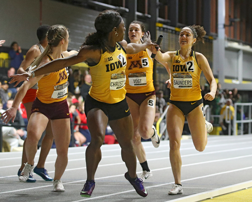 Iowa’s Antonise Christian (from left) takes the baton from Tia Saunders runs the women’s 1600 meter relay premier event during the Larry Wieczorek Invitational at the Recreation Building in Iowa City on Saturday, January 18, 2020. (Stephen Mally/hawkeyesports.com)