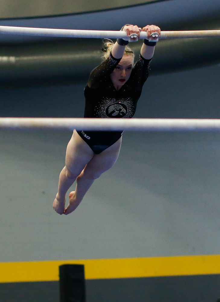 Annabelle Moser competes on the uneven bars during the Black and Gold Intrasquad meet at the Field House on 12/2/17. (Tork Mason/hawkeyesports.com)
