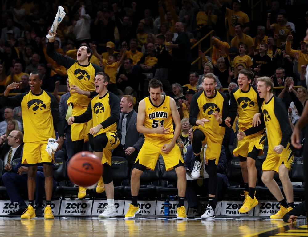 The Iowa Hawkeyes celebrate after winning a aeagainst the Wisconsin Badgers Friday, November 30, 2018 at Carver-Hawkeye Arena. (Brian Ray/hawkeyesports.com)