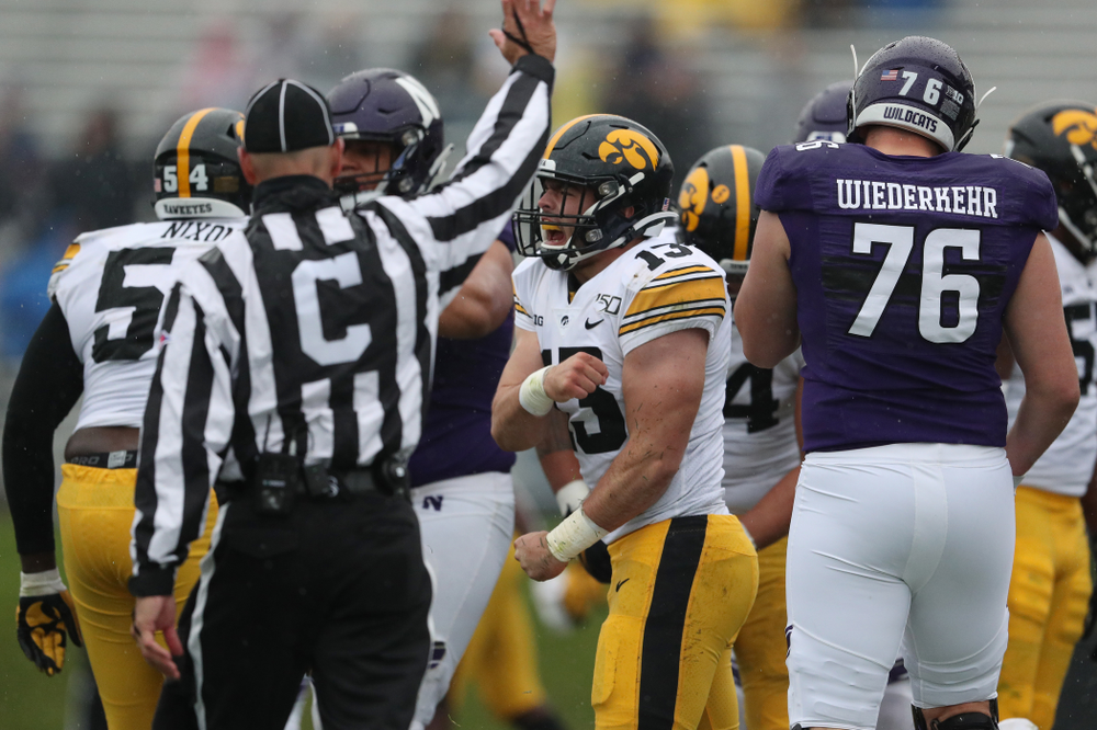 Iowa Hawkeyes linebacker Joe Evans (13) celebrates his first career sack against the Northwestern Wildcats Saturday, October 26, 2019 at Ryan Field in Evanston, Ill. (Brian Ray/hawkeyesports.com)