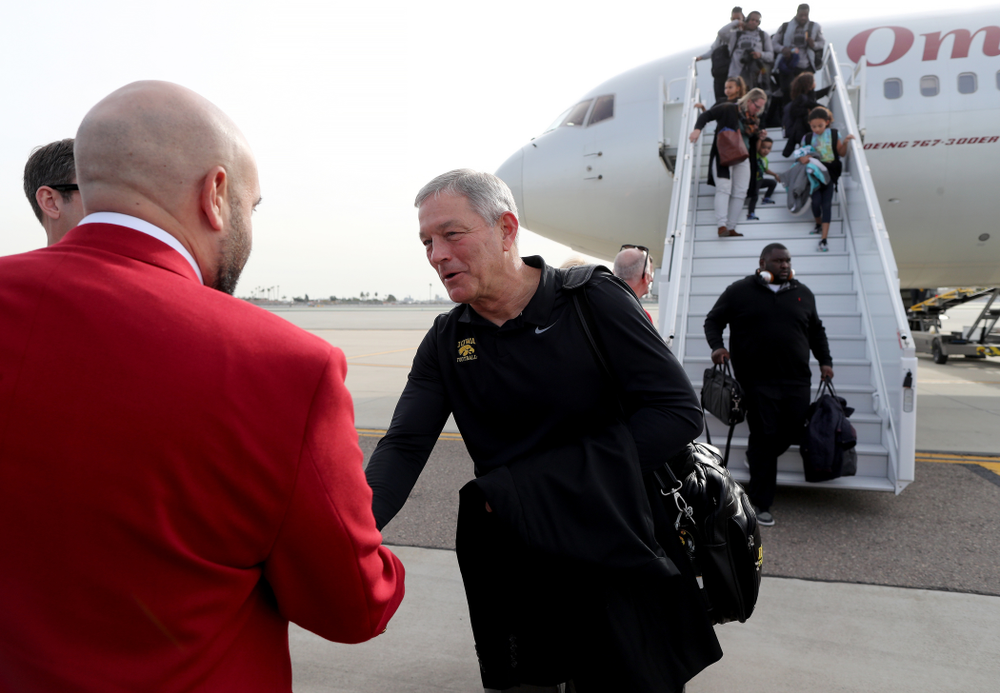 Iowa Hawkeyes head coach Kirk Ferentz shakes hands with the ÒRed CoatsÓ after arriving in San Diego, CA Saturday, December 21, 2019 for the Holiday Bowl. (Brian Ray/hawkeyesports.com)