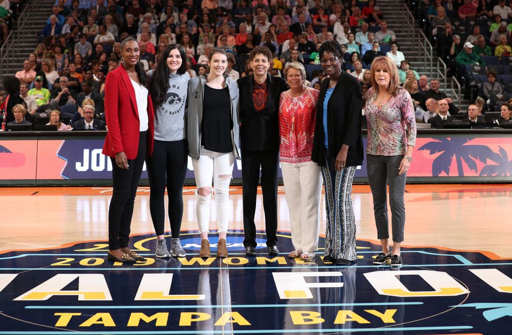 Iowa Hawkeyes forward Megan Gustafson (10) and Iowa State's Bridget Carleton are introduced with Naismith Starting 5 namesakes during a timeout in the second half of the National Semi-Final between Baylor and Oregon Friday, April 5, 2019 at Amalie Arena in Tampa, FL. (Brian Ray/hawkeyesports.com)