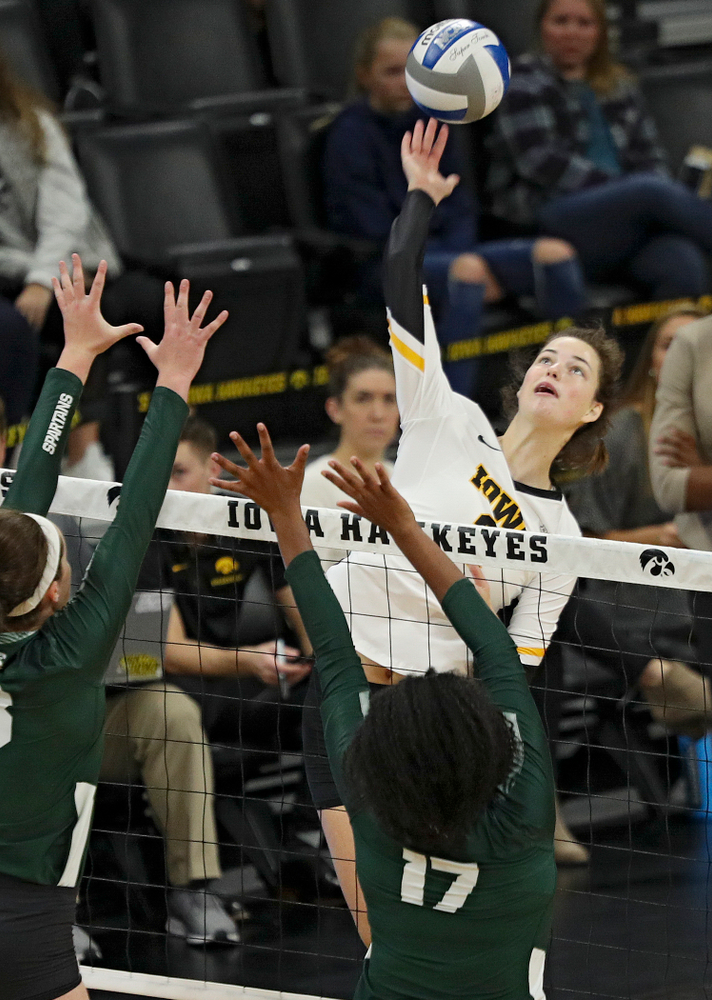 Iowa’s Courtney Buzzerio (2) goes up for a kill during the first set of their volleyball match at Carver-Hawkeye Arena in Iowa City on Sunday, Oct 13, 2019. (Stephen Mally/hawkeyesports.com)