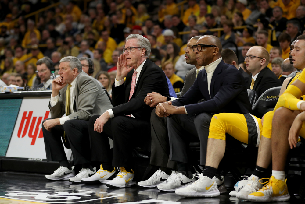 The Iowa Hawkeyes coaching staff wears sneakers with their suits against the Rutgers Scarlet Knights Wednesday, January 22, 2020 at Carver-Hawkeye Arena. (Brian Ray/hawkeyesports.com)