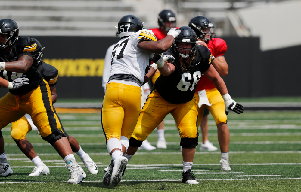 Iowa Hawkeyes offensive lineman Levi Paulsen (66) and defensive end Chauncey Golston (57) during Kids Day Saturday, August 11, 2018 at Kinnick Stadium. (Brian Ray/hawkeyesports.com)