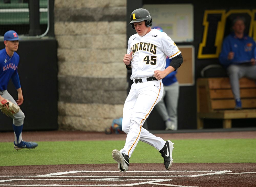 Iowa first baseman Peyton Williams (45) scores a run during the first inning of their college baseball game at Duane Banks Field in Iowa City on Wednesday, March 11, 2020. (Stephen Mally/hawkeyesports.com)