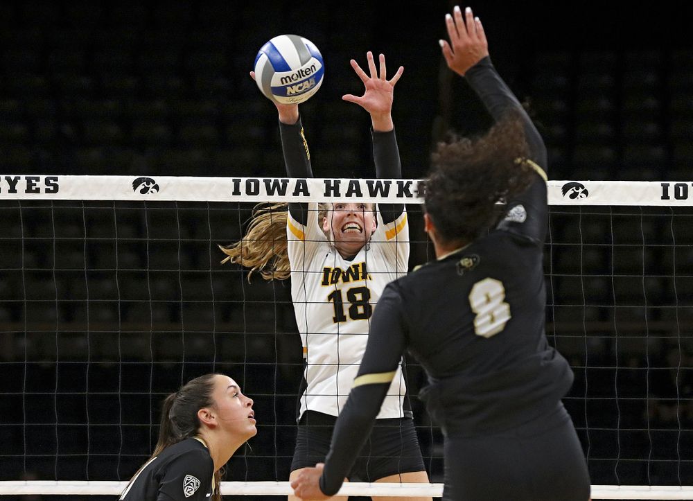 Iowa’s Hannah Clayton (18) gets her hands on a shot during the third set of their Big Ten/Pac-12 Challenge match against Colorado at Carver-Hawkeye Arena in Iowa City on Friday, Sep 6, 2019. (Stephen Mally/hawkeyesports.com)