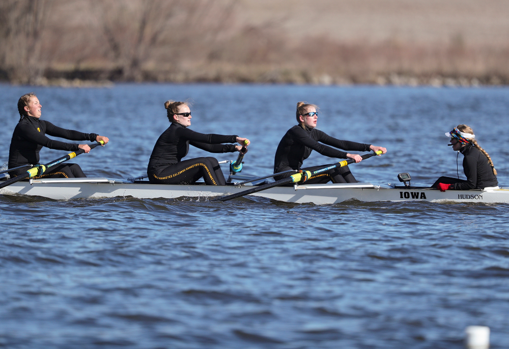 Iowa's Molly Rygh (from left), Kirsten Jurgersen, Amelia Juhl, and Alexis Wolf during their I Novice 8 race against Wisconsin in their Big Ten Double Dual Rowing Regatta at Lake Macbride in Solon on Saturday, Apr. 13, 2019. (Stephen Mally/hawkeyesports.com)