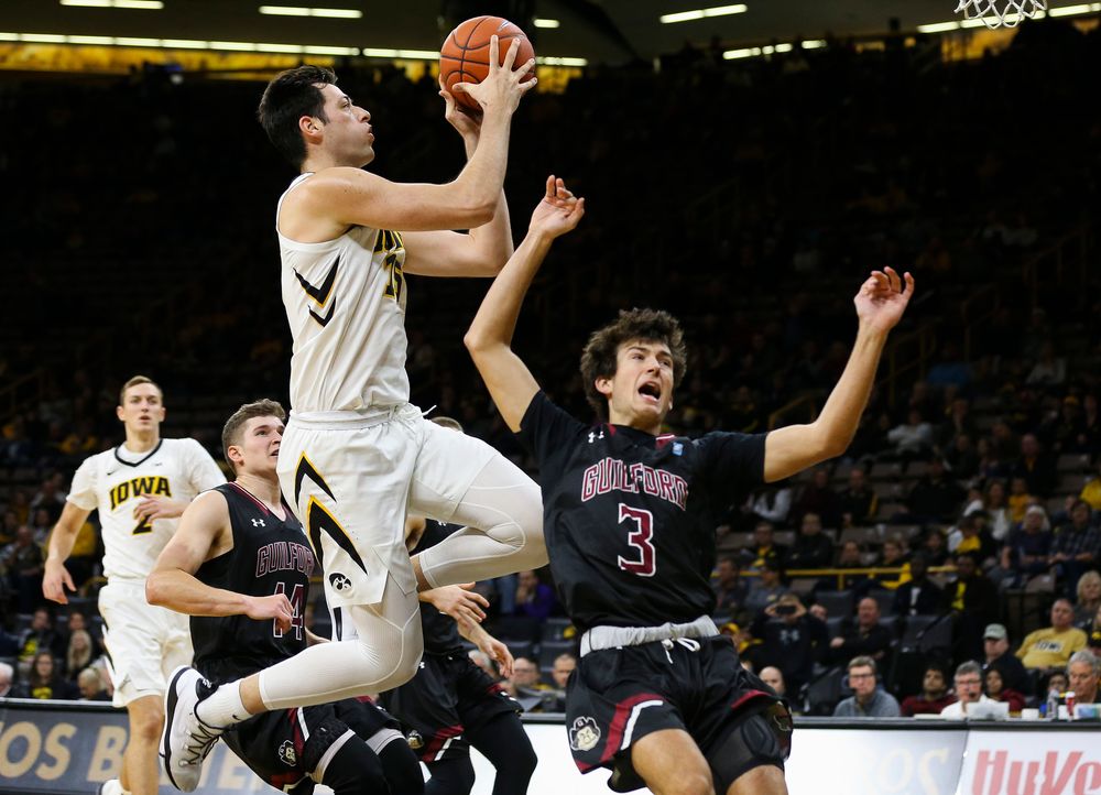 Iowa Hawkeyes forward Ryan Kriener (15) goes up for a shot during a game against Guilford College at Carver-Hawkeye Arena on November 4, 2018. (Tork Mason/hawkeyesports.com)