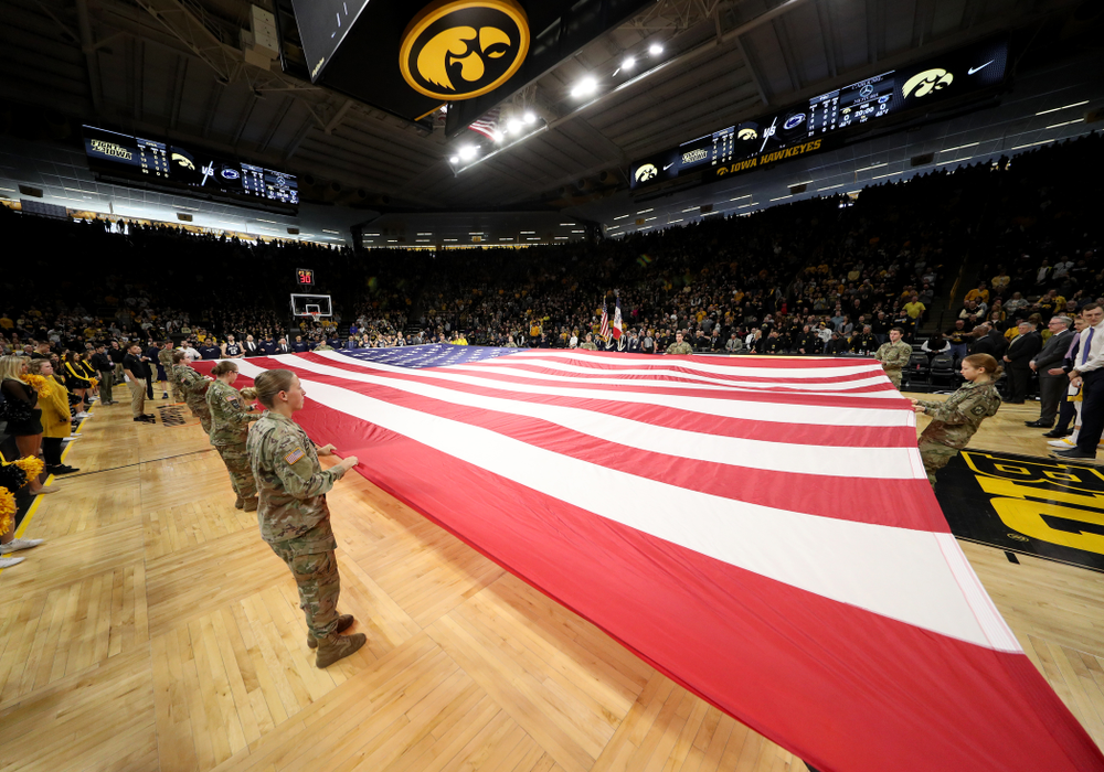 Members of the Iowa Army ROTC display a large American flag before the Iowa Hawkeyes game against Penn State Saturday, February 29, 2020 at Carver-Hawkeye Arena. (Brian Ray/hawkeyesports.com)