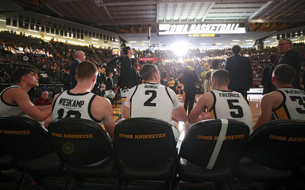 Iowa Hawkeyes center Luka Garza (55), guard Joe Wieskamp (10), forward Jack Nunge (2), guard CJ Fredrick (5), and guard Connor McCaffery (30) wait to be introduced before their game at Carver-Hawkeye Arena in Iowa City on Sunday, Nov 24, 2019. (Stephen Mally/hawkeyesports.com)