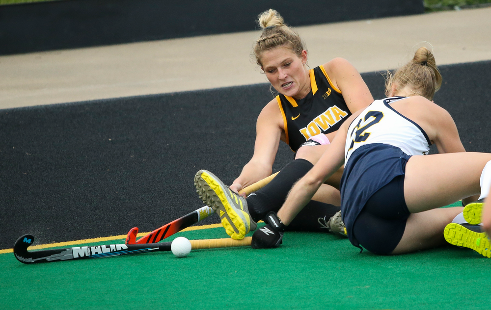 Iowa Hawkeyes midfielder Ellie Holley (7) fights to keep the ball in bounds during a game against Michigan at Grant Field on October 5, 2018. (Tork Mason/hawkeyesports.com)