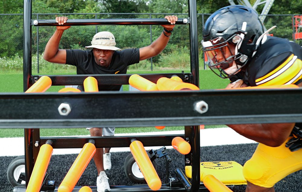 Iowa Hawkeyes running backs coach Derrick Foster looks on as running back Mekhi Sargent (10) runs a drill during Fall Camp Practice No. 11 at the Hansen Football Performance Center in Iowa City on Wednesday, Aug 14, 2019. (Stephen Mally/hawkeyesports.com)