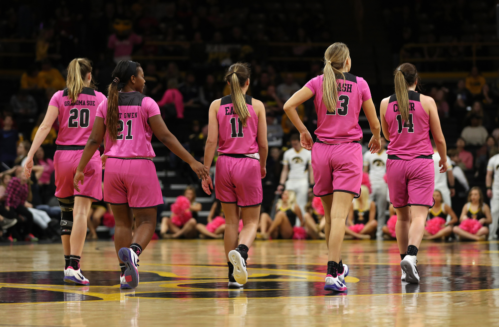 Iowa Hawkeyes guard Kate Martin (20), guard Zion Sanders (21), guard Megan Meyer (11), Logan Cook (23), and forward McKenna Warnock (14) against the Wisconsin Badgers Sunday, February 16, 2020 at Carver-Hawkeye Arena. (Brian Ray/hawkeyesports.com)