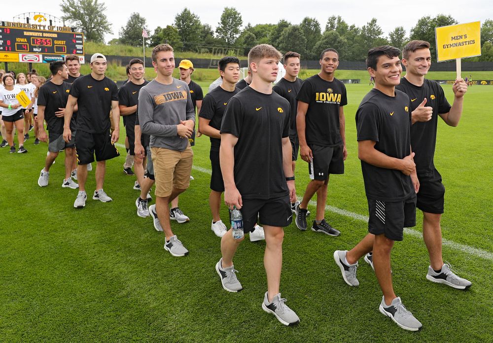 Student-athletes walk in the Parade of Champions during the Student-Athlete Kickoff at the Iowa Soccer Complex in Iowa City on Sunday, Aug 25, 2019. (Stephen Mally/hawkeyesports.com)