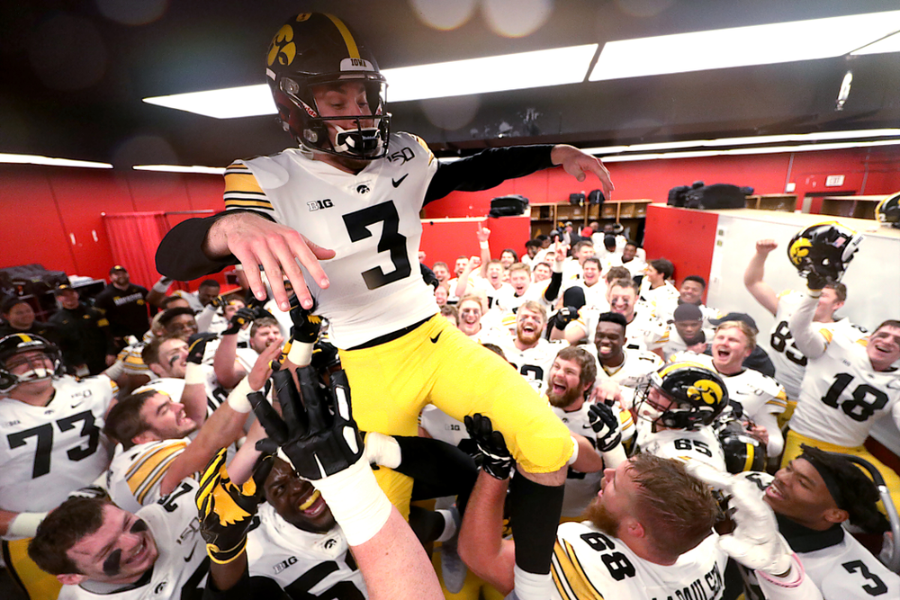 The Iowa Hawkeyes hoist up place kicker Keith Duncan (3) as they celebrate their victory against the Nebraska Cornhuskers Friday, November 29, 2019 at Memorial Stadium in Lincoln, Neb. (Brian Ray/hawkeyesports.com)