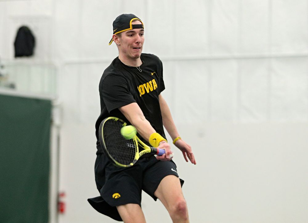Iowa’s Nikita Snezhko returns a shot during his singles match at the Hawkeye Tennis and Recreation Complex in Iowa City on Friday, March 6, 2020. (Stephen Mally/hawkeyesports.com)