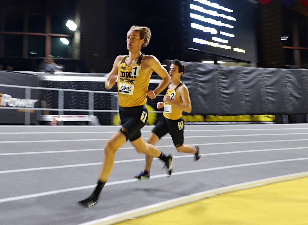 Iowa’s Jeff Roberts (from left) and Noah Healy run the men’s 1 mile run event during the Jimmy Grant Invitational at the Recreation Building in Iowa City on Saturday, December 14, 2019. (Stephen Mally/hawkeyesports.com)
