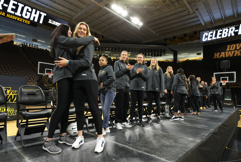 Iowa Hawkeyes forward Megan Gustafson (10) hugs forward Hannah Stewart (21) after finding out her jersey will be retired at a ceremony next season during the teamÕs Celebr-Eight event Wednesday, April 24, 2019 at Carver-Hawkeye Arena. (Brian Ray/hawkeyesports.com)