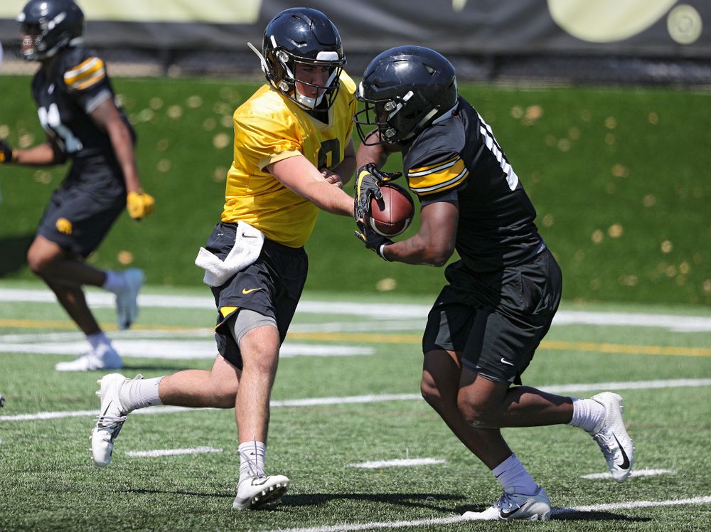 Iowa Hawkeyes quarterback Alex Padilla (8) hands the ball off to running back Tyler Goodson (15) during Fall Camp Practice No. 7 at the Hansen Football Performance Center in Iowa City on Friday, Aug 9, 2019. (Stephen Mally/hawkeyesports.com)