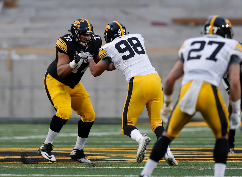 Iowa Hawkeyes offensive lineman Alaric Jackson (77) and defensive end Anthony Nelson (98) during the final spring practice Friday, April 20, 2018 at Kinnick Stadium. (Brian Ray/hawkeyesports.com)