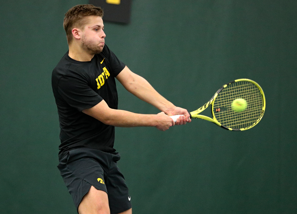 Iowa’s Will Davies returns a shot during his singles match at the Hawkeye Tennis and Recreation Complex in Iowa City on Friday, February 14, 2020. (Stephen Mally/hawkeyesports.com)