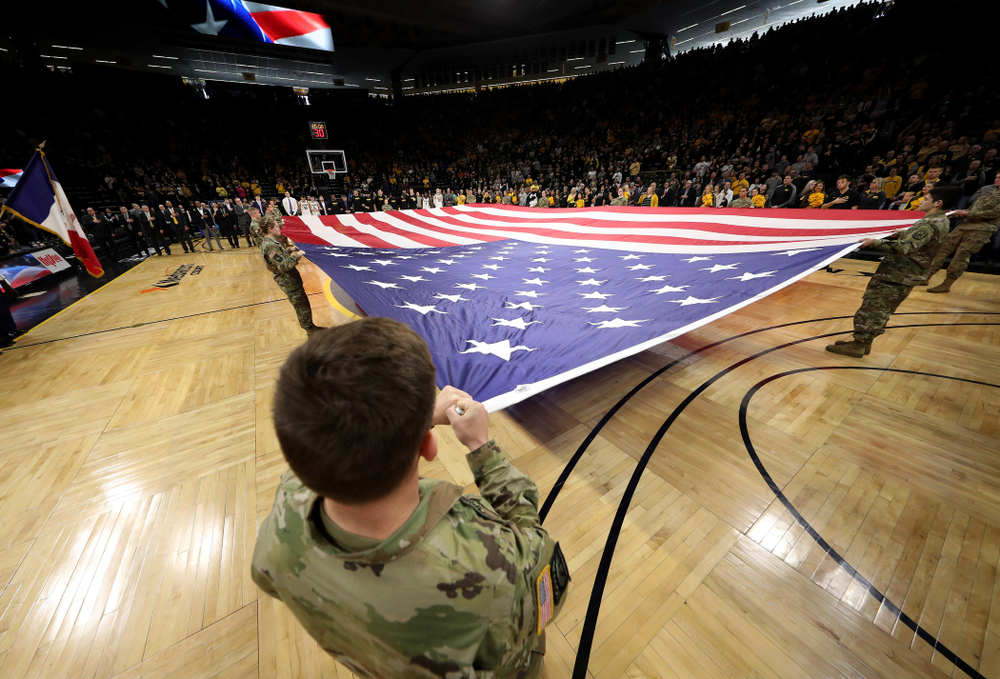Members of the Iowa Army ROTC display a large American flag before the Iowa Hawkeyes game against Penn State Saturday, February 29, 2020 at Carver-Hawkeye Arena. (Brian Ray/hawkeyesports.com)