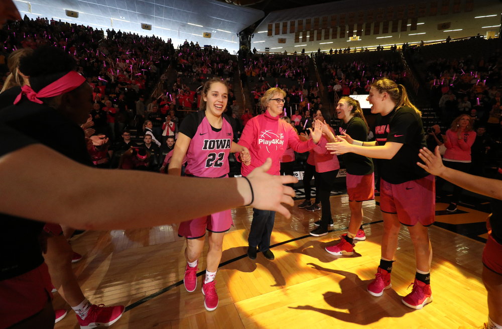 Iowa Hawkeyes guard Kathleen Doyle (22) is introduced with a cancer survivor before their game against the seventh ranked Maryland Terrapins Sunday, February 17, 2019 at Carver-Hawkeye Arena. (Brian Ray/hawkeyesports.com)