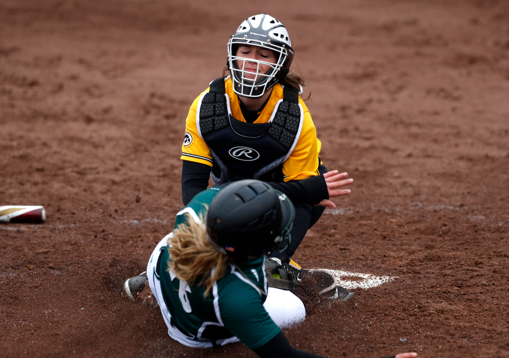 Iowa Hawkeyes catcher Angela Schmiederer (12) against UW Green Bay Tuesday, March 27, 2018 at Bob Pearl Field. (Brian Ray/hawkeyesports.com)