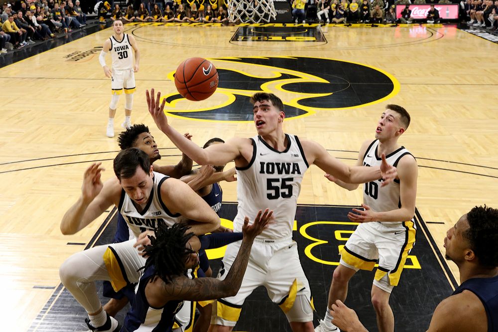 Iowa Hawkeyes forward Luka Garza (55) grabs a rebound against Penn State Saturday, February 29, 2020 at Carver-Hawkeye Arena. (Brian Ray/hawkeyesports.com)