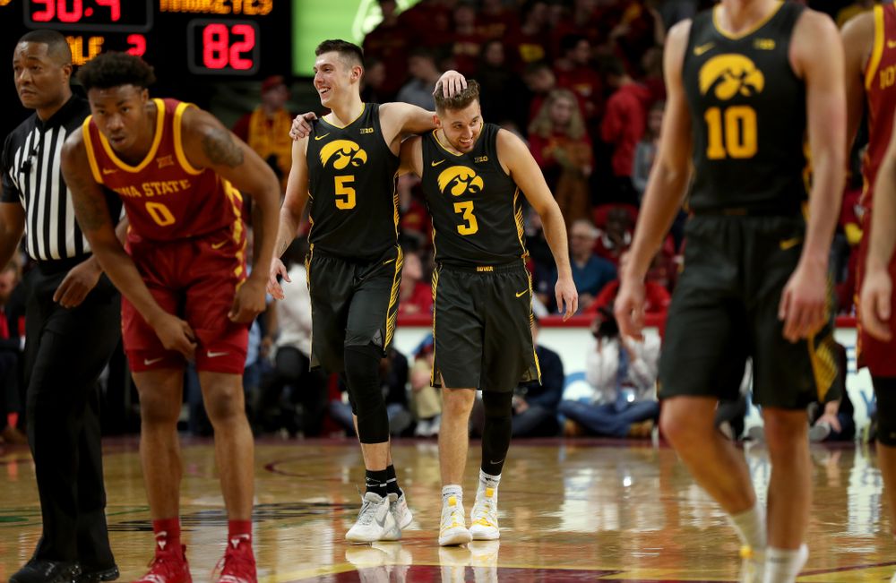 Iowa Hawkeyes guard CJ Fredrick (5) and guard Jordan Bohannon (3) against the Iowa State Cyclones Thursday, December 12, 2019 at Hilton Coliseum in Ames, Iowa(Brian Ray/hawkeyesports.com)