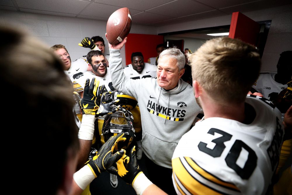 Iowa Hawkeyes defensive back Jake Gervase (30) presents the game ball to head coach Kirk Ferentz to commemorate his 150th win as head coach fo the Iowa Hawkeyes following their 63-0 win over the Illinois Fighting Illini Saturday, November 17, 2018 at Memorial Stadium in Champaign, Ill. (Brian Ray/hawkeyesports.com)