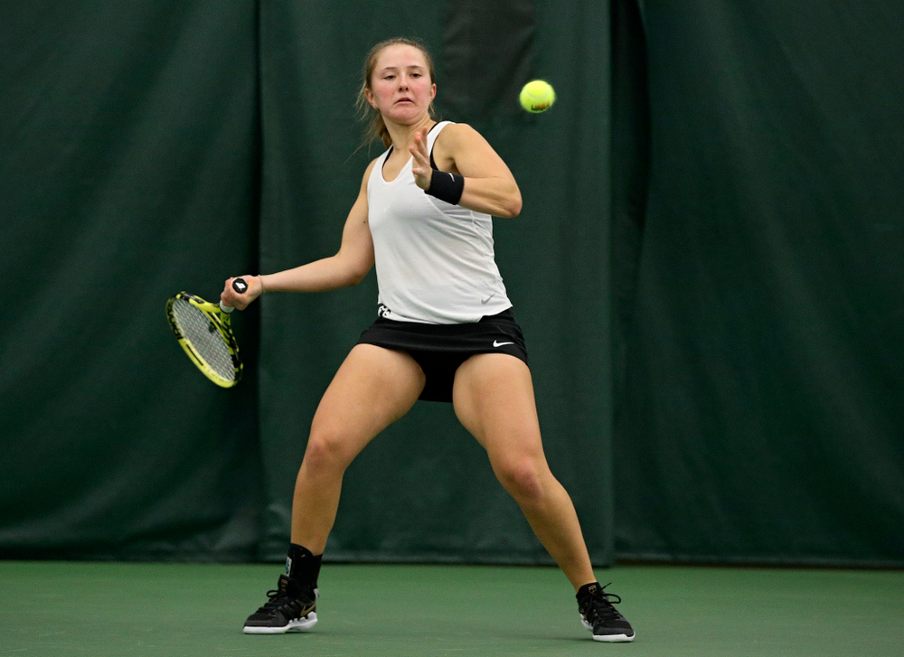Iowa’s Danielle Burich returns a shot during her singles match at the Hawkeye Tennis and Recreation Complex in Iowa City on Sunday, February 23, 2020. (Stephen Mally/hawkeyesports.com)