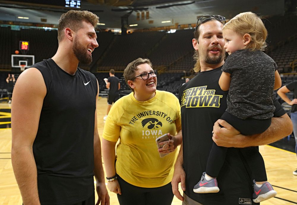 Iowa Hawkeyes guard Jordan Bohannon (3) talks with visitors from University of Iowa Hospitals and Clinics Adolescent and Young Adult (AYA) Cancer Program after practice at Carver-Hawkeye Arena in Iowa City on Monday, Sep 30, 2019. (Stephen Mally/hawkeyesports.com)