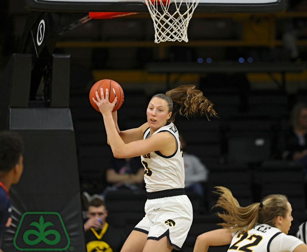 Iowa Hawkeyes forward Amanda Ollinger (43) pulls down a rebound during the third quarter of their game at Carver-Hawkeye Arena in Iowa City on Tuesday, December 31, 2019. (Stephen Mally/hawkeyesports.com)
