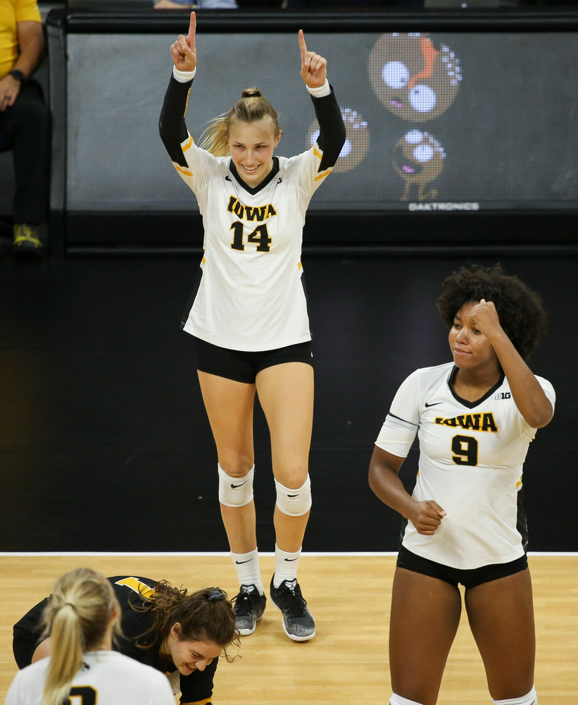 Iowa Hawkeyes outside hitter Cali Hoye (14) and Iowa Hawkeyes middle blocker Amiya Jones (9) reacts after a kill during a game against Purdue at Carver-Hawkeye Arena on October 13, 2018. (Tork Mason/hawkeyesports.com)