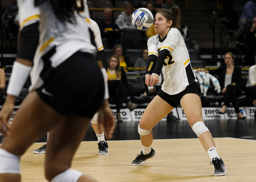 Iowa Hawkeyes defensive specialist Emily Bushman (12) bumps the ball during a match against Maryland at Carver-Hawkeye Arena on November 23, 2018. (Tork Mason/hawkeyesports.com)