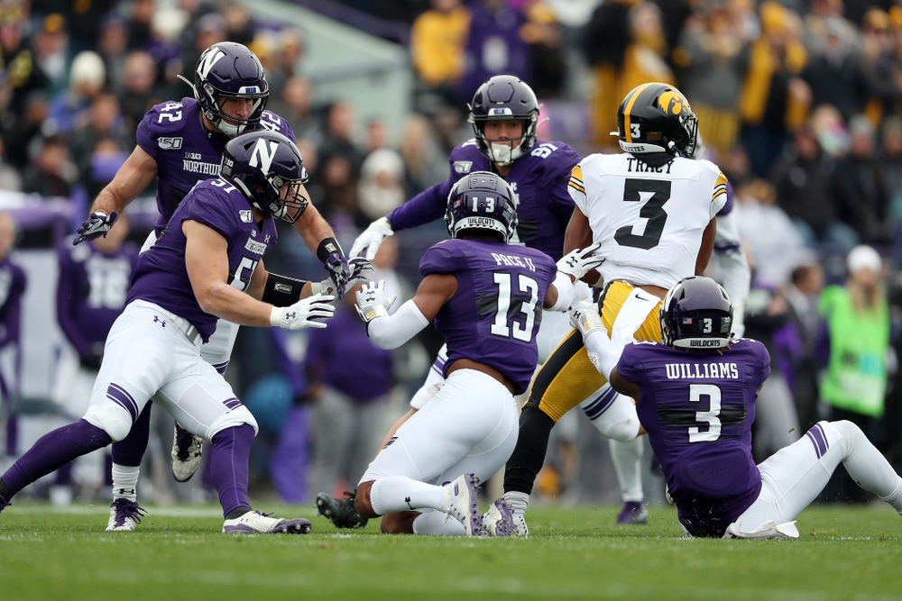 Iowa Hawkeyes wide receiver Tyrone Tracy Jr. (3) spins away from 5 defenders on his way to a touchdown against the Northwestern Wildcats Saturday, October 26, 2019 at Ryan Field in Evanston, Ill. (Brian Ray/hawkeyesports.com)