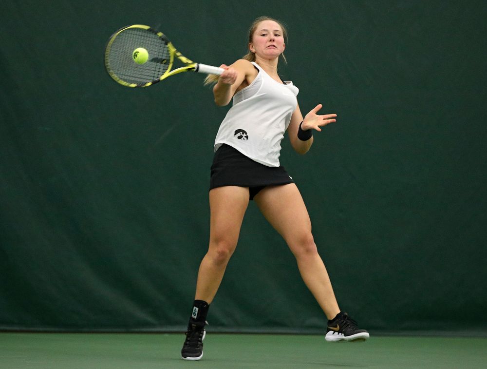 Iowa’s Danielle Burich returns a shot during her singles match at the Hawkeye Tennis and Recreation Complex in Iowa City on Sunday, February 23, 2020. (Stephen Mally/hawkeyesports.com)